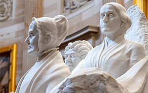 Stone carving of women.