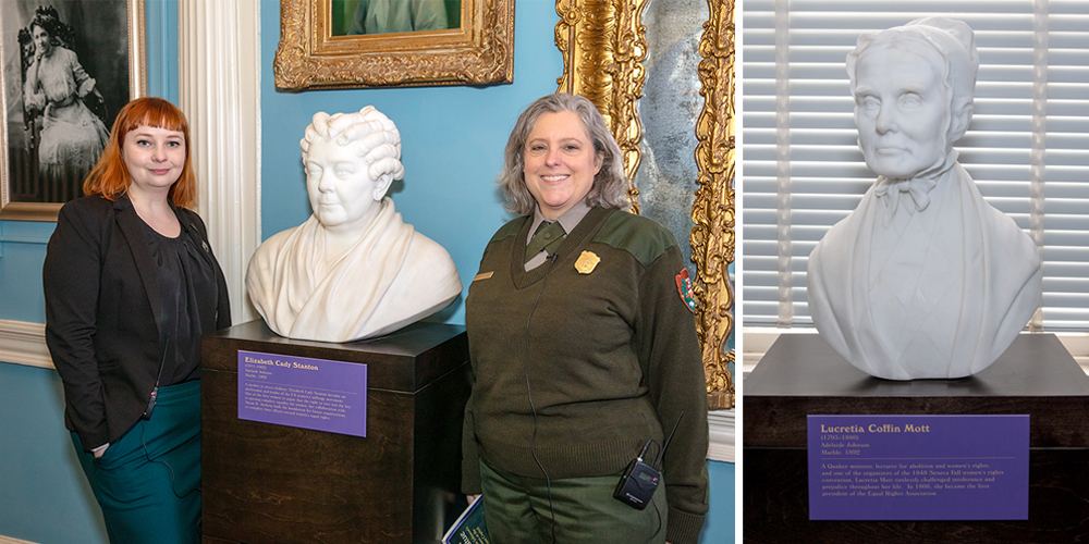 two women standing on the right and left of a bust of a woman with short curled hair 