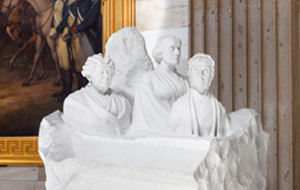 Marble statue of three women.