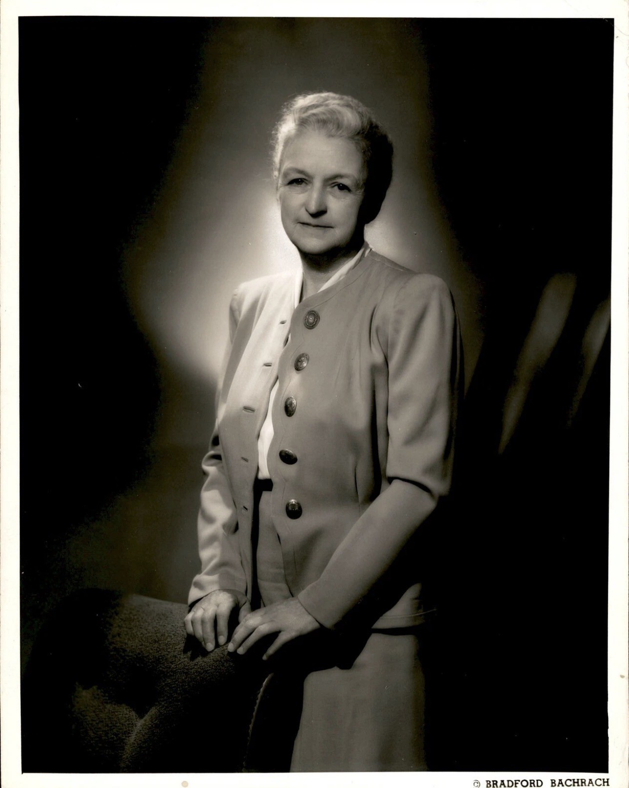Black and white image of a woman standing