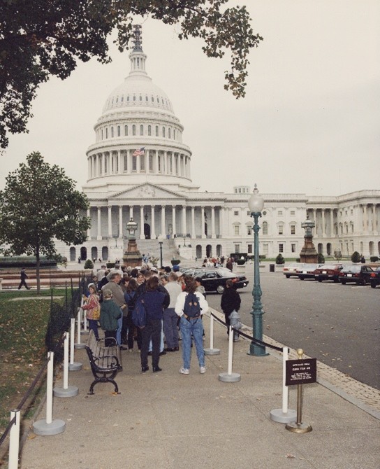 People standing in front of the Capitol Building.