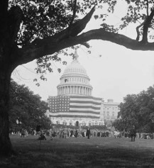 Largest American flag in the world displayed across the front of the U.S. Capitol, 1929.