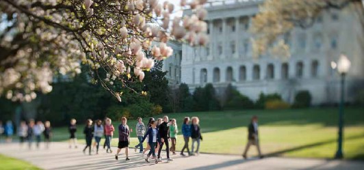 Kids walking outside the Capitol Building.