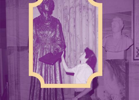 purple tinted photograph of a women reaching up to touch a statue of Jeanette Rankin