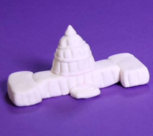 handmade model of the U.S. Capitol crafted from white clay on a purple background