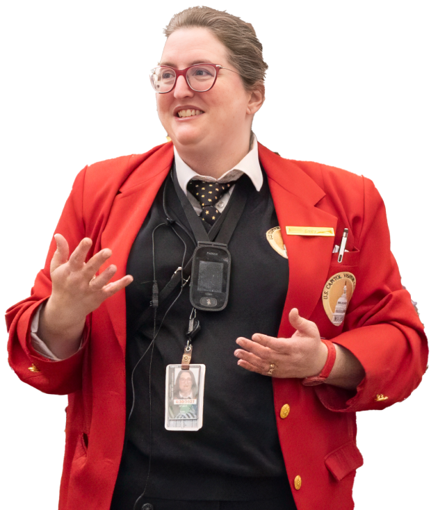 Visitor Guide wearing a red blazer and gesturing with both hands