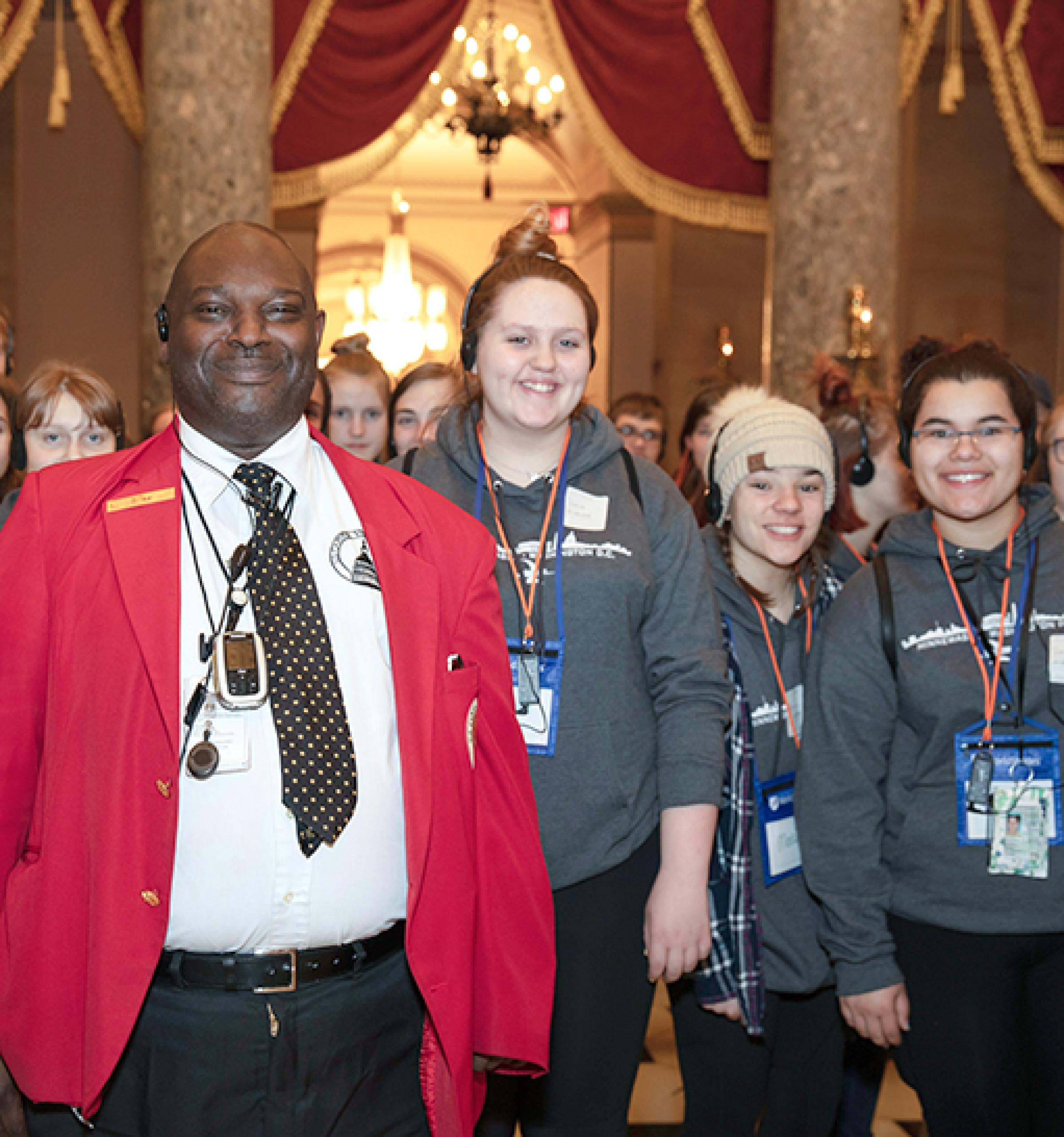Visitor Guide with students in National Statuary Hall