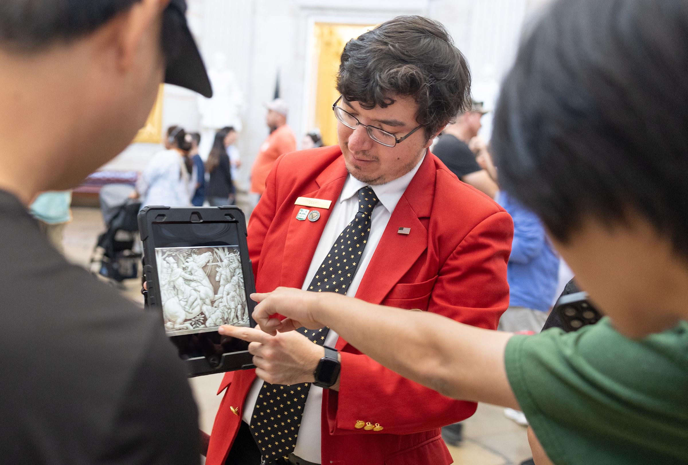 A visitor guide helping guests. 