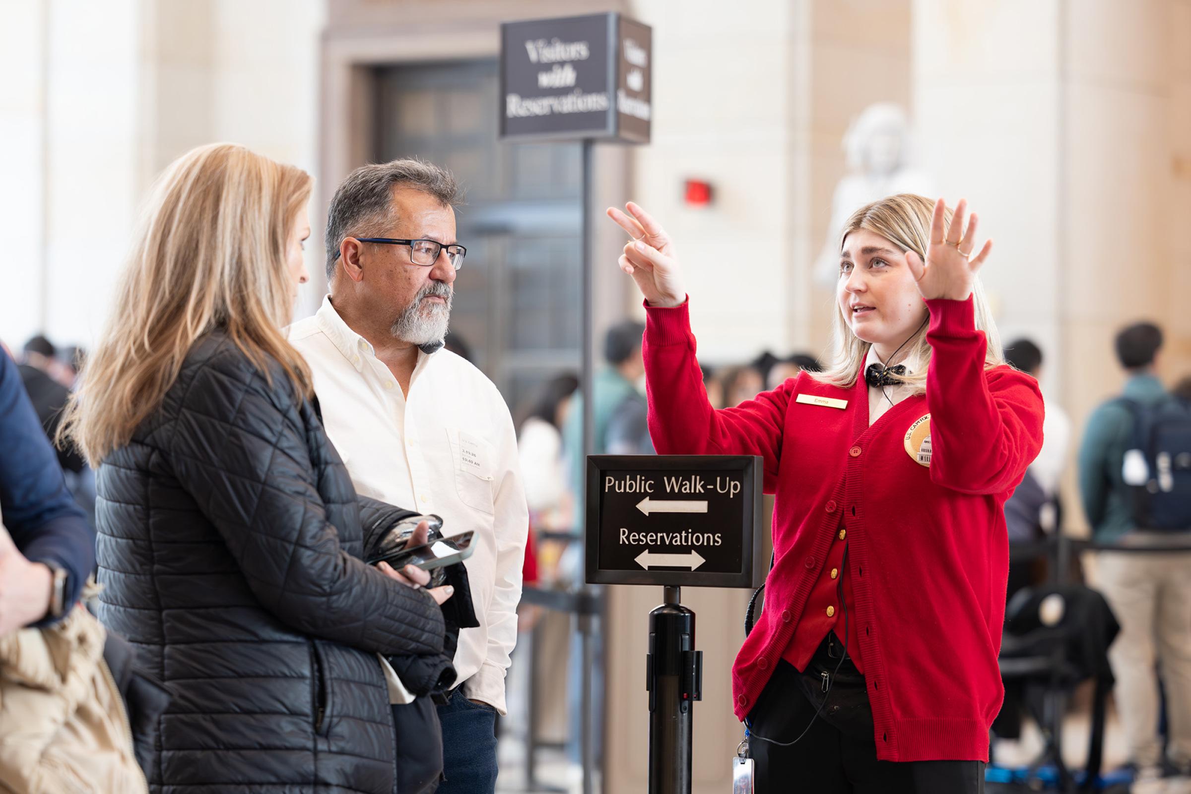 A visitor guide helping guests. 