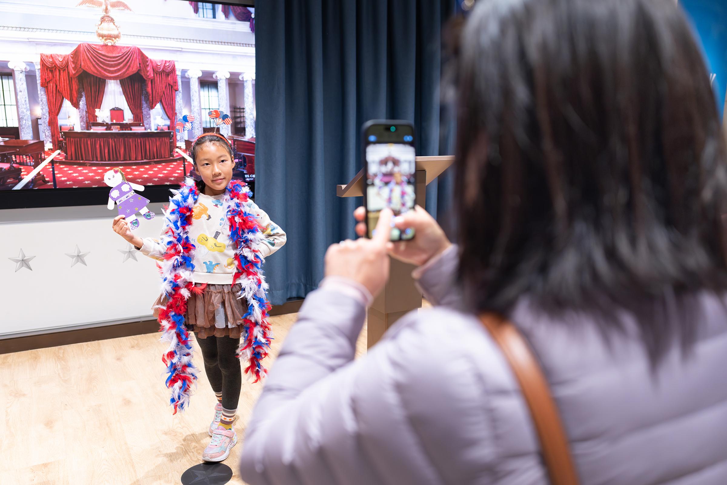 Child getting their picture taken.