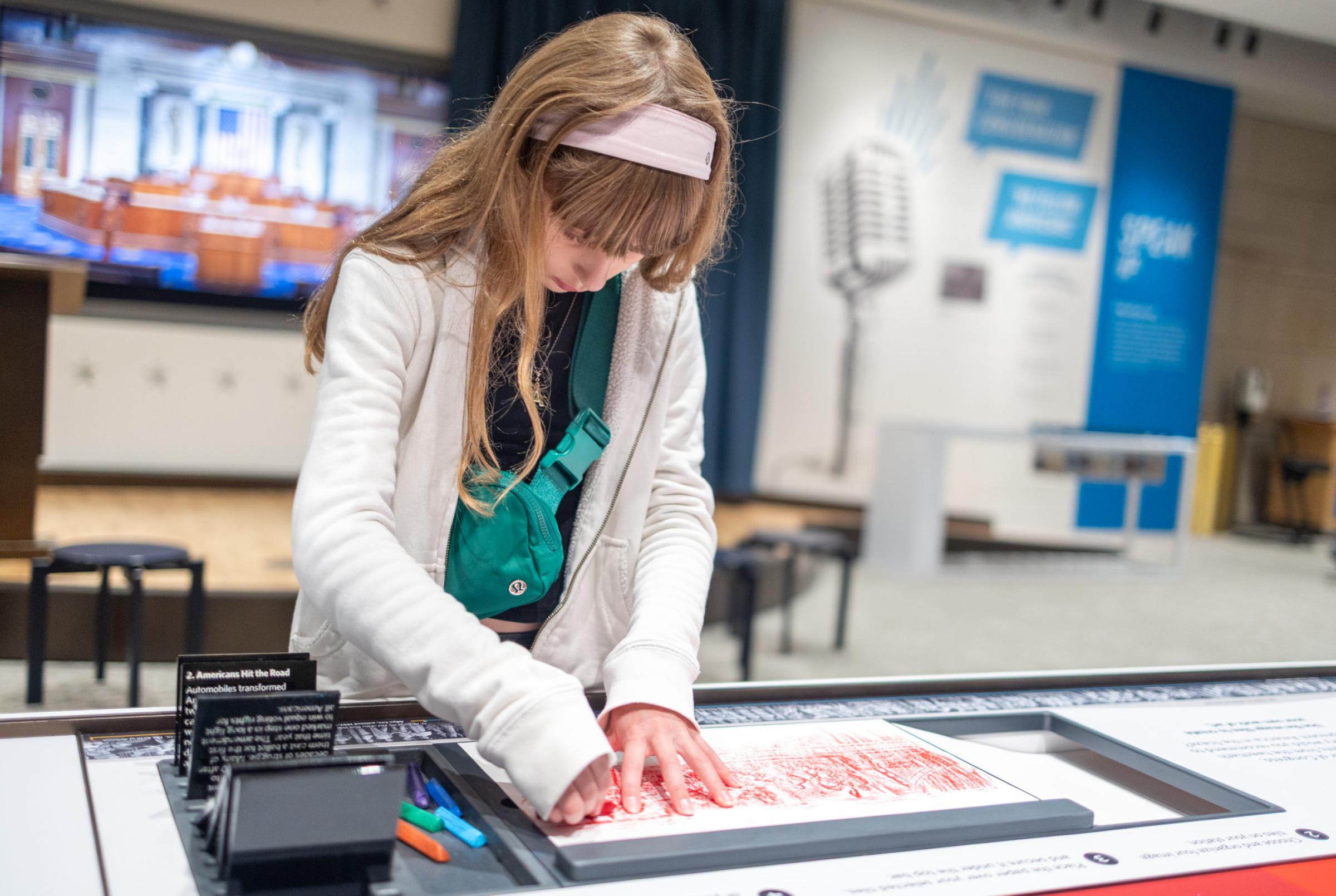 Child working on a project at a table. 