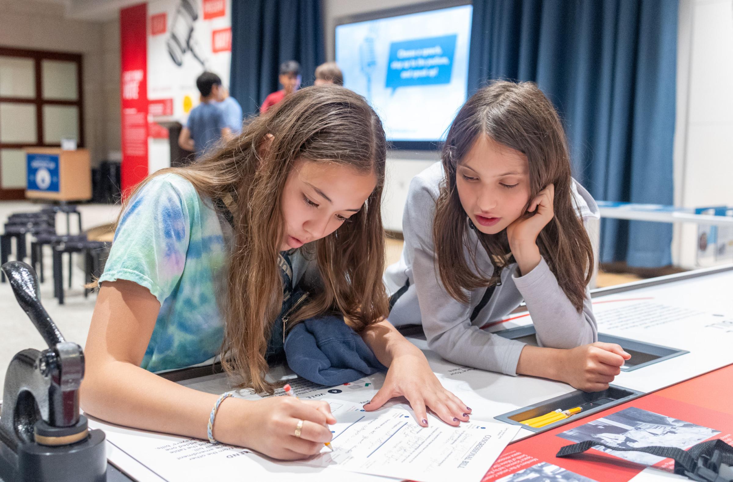 Children working at a table. 