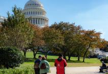 Staff and visitors walking on the West Front of the Capitol