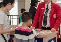 Visitor Guide at information cart