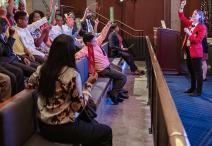 Visitors engaging with Visitor Guide in a Vote program