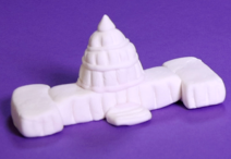 handmade model of the U.S. Capitol crafted from white clay on a purple background