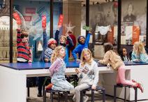 group of students voting at a table in Democracy Lab