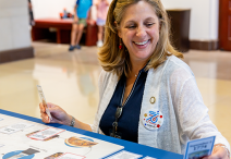 Smiling woman at a table