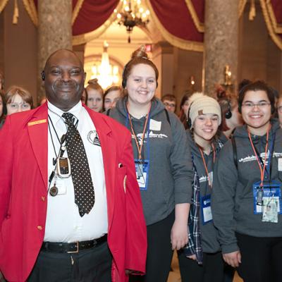 Visitor Guide with students in National Statuary Hall