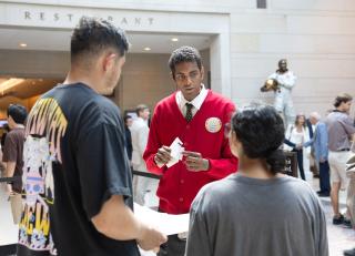 A visitor guide helping guests. 