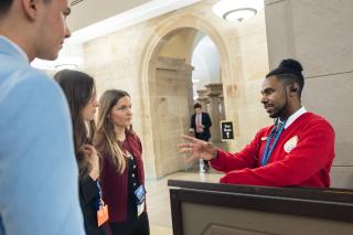 A visitor guide helping guests. 