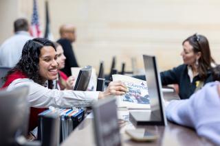A visitor guide helping guests. 