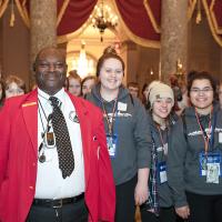 Visitor Guide with students in National Statuary Hall